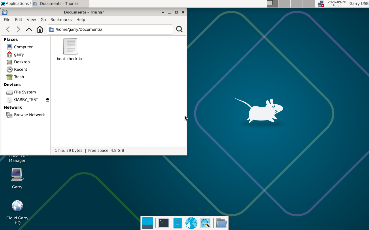Actual Debian XFCE desktop in a UEFI virtual machine, with the file manager showing a document that survived reboot.